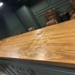 Basement remodel featuring custom live-edge bar by Mr.Countertops