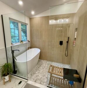 Industrial-style Cleveland bathroom remodel with slate wall tile, white porcelain vessel sink, and handcrafted hardwood vanity.