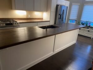 Kitchen remodel featuring custom plank style butcher block countertops & Island