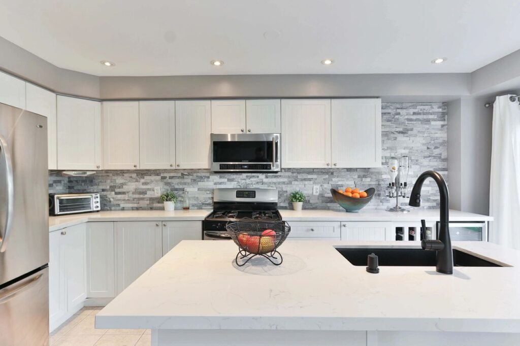 Custom Solid Surface Countertops and tile backsplash in modern eco-friendly kitchen remodel