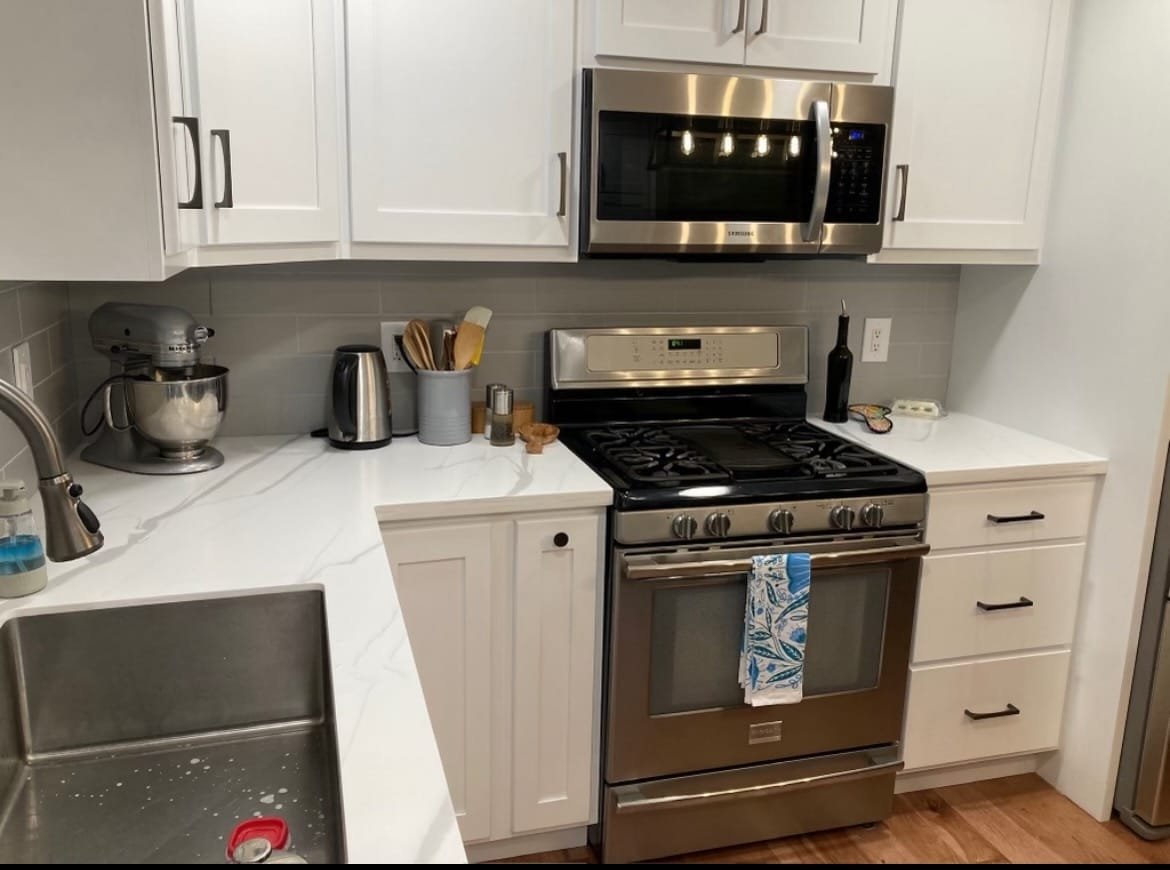 White custom solid surface countertops in modern Northeast, OH kitchen