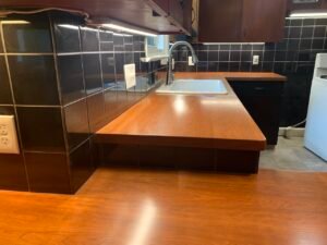 Stunning black tile backsplash and custom butcher block countertops in Wooster, OH kitchen by Mr.Countertops
