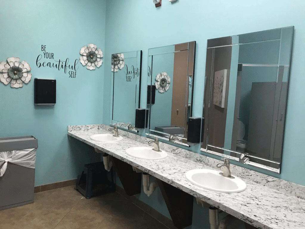 Custom 4-bay solid surface bathroom vanity installed in a Northeast Ohio church