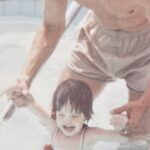 Shannon at age 2 with her dad, Brandt in the pool. He is clutching her arms and holding her above the water. | Mr.Countertops