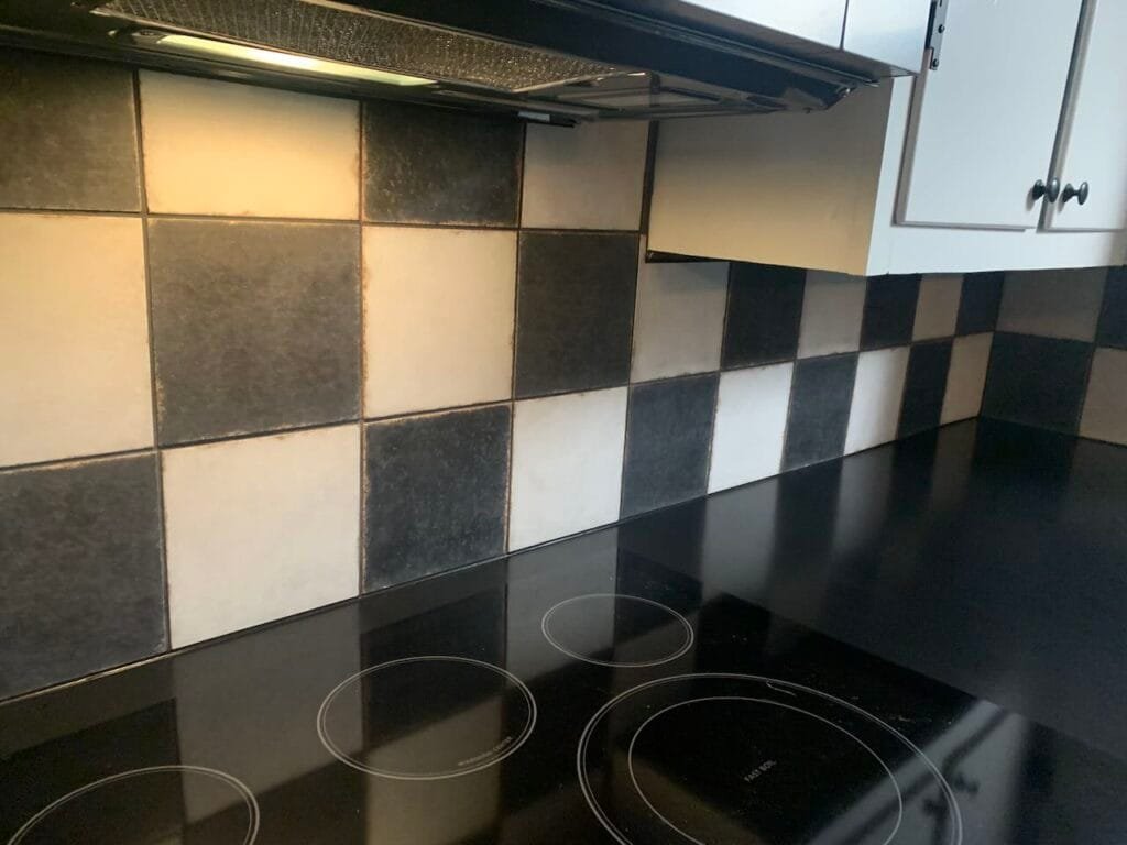 Black and white rustic tile backsplash installation in Medina, OH