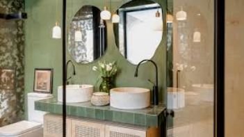 Bathroom remodel in NEO using glass tile, shades of jade & cream, and custom vanity by Mr.Countertops
