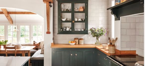 Kitchen remodel featuring Olive green custom cabinets and custom butcher block countertops 