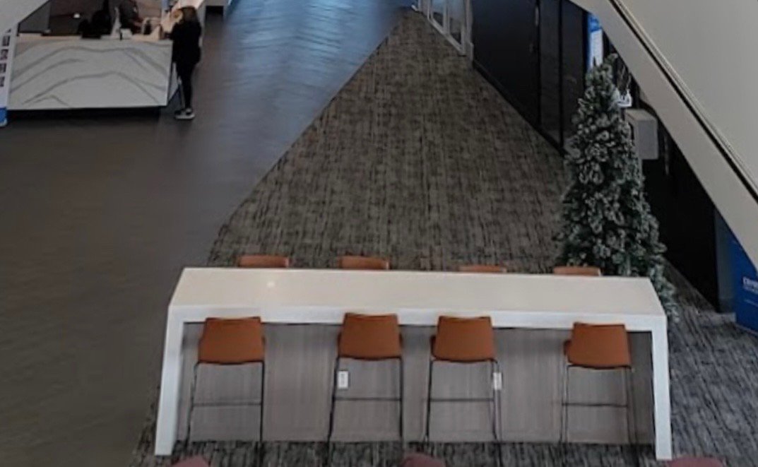 Hospital Waiting Room Solid Surface Wall Panels, Tables, and Custom Reception Desks.