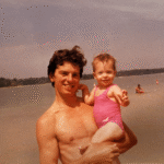 Shannon as a baby being held by her Dad on the Beach | Mr.Countertops