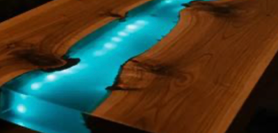 Live edge wood slab with hidden LED lighting illuminating the natural edge.