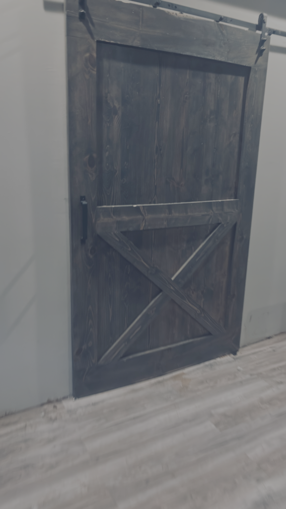 Custom Barn Door with rustic blue finish at Mr.Countertops in Wadsworth, OH