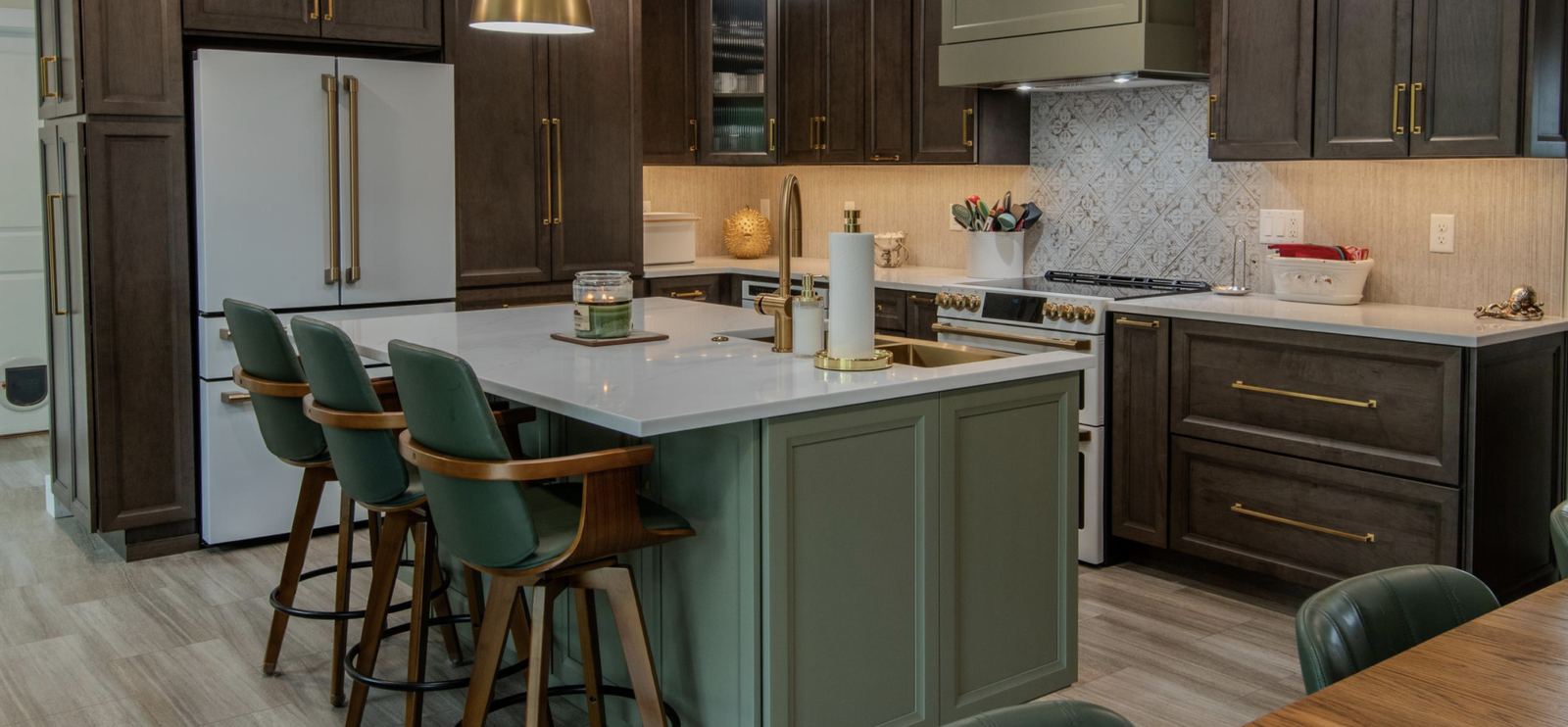 Modern Pepper Pike kitchen remodel featuring custom resurfaced tall cabinets in matte charcoal, a light sage green custom island with seating, and seamless white solid surface countertops.