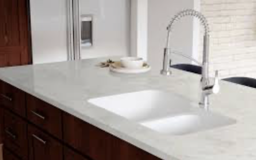 Modern residential kitchen countertop with a seamless integrated solid surface sink installed in Medina, Ohio