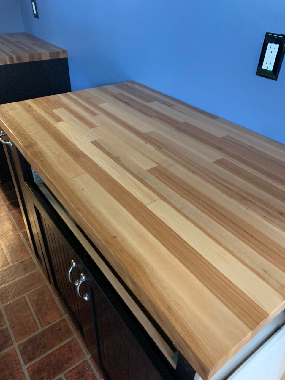 Custom Acacia Countertops with staggered wood pattern.