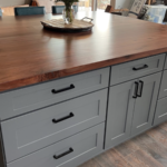 Custom solid Black Walnut kitchen island countertop with artisan edge detail by Mr.Countertops.