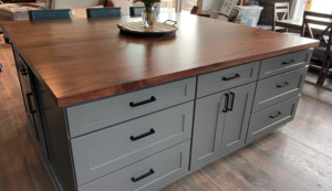 Custom solid Black Walnut kitchen island countertop with artisan edge detail by Mr.Countertops.