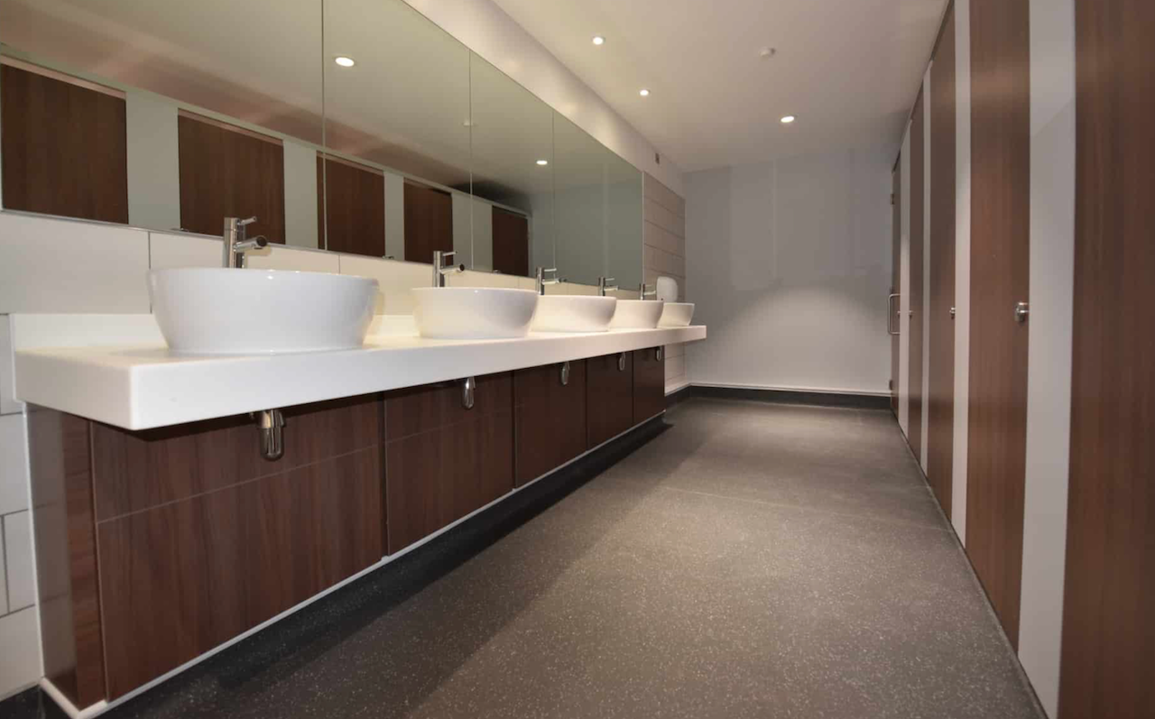 Commercial 5-bay vanity with vessel sinks.