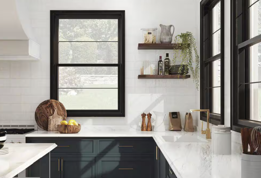 Calacatta marble laminate countertops with light veining installed in a kitchen remodel with bold green cabinets by Mr.Countertops in Northeast Ohio