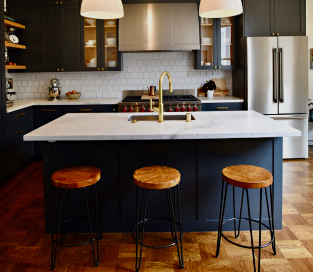 Kitchen Remodel in Strongsville, OH by Mr.Countertops with White Countertops and Navy Cabinets with Modern Lighting fixtures in Northeast Ohio Kitchen