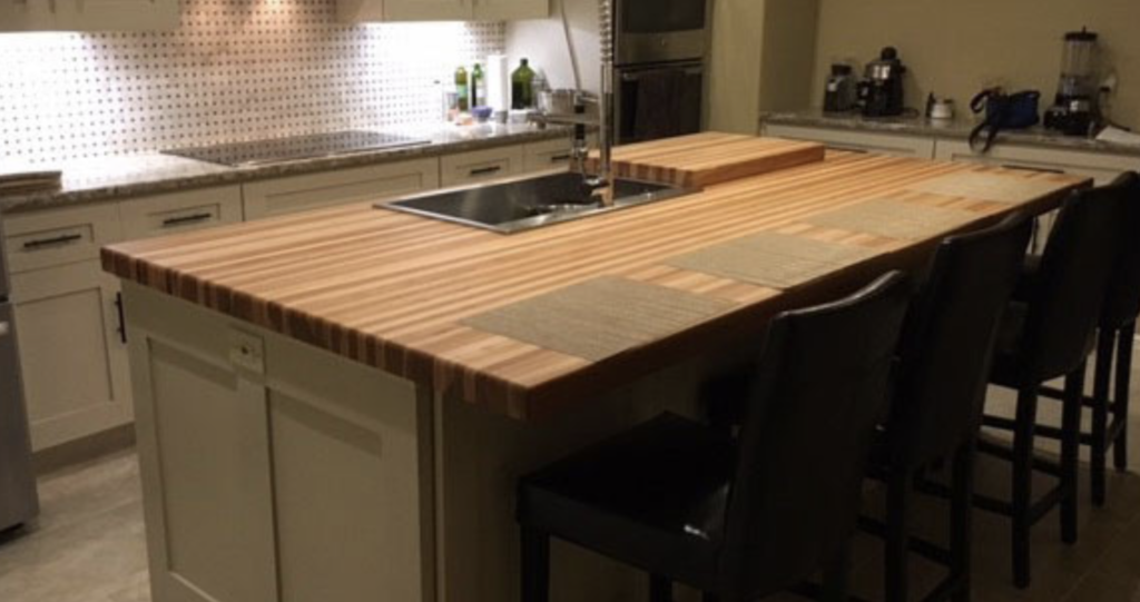 Heavy-duty custom Hickory wood countertop showcasing natural calico color variations and extreme hardness.