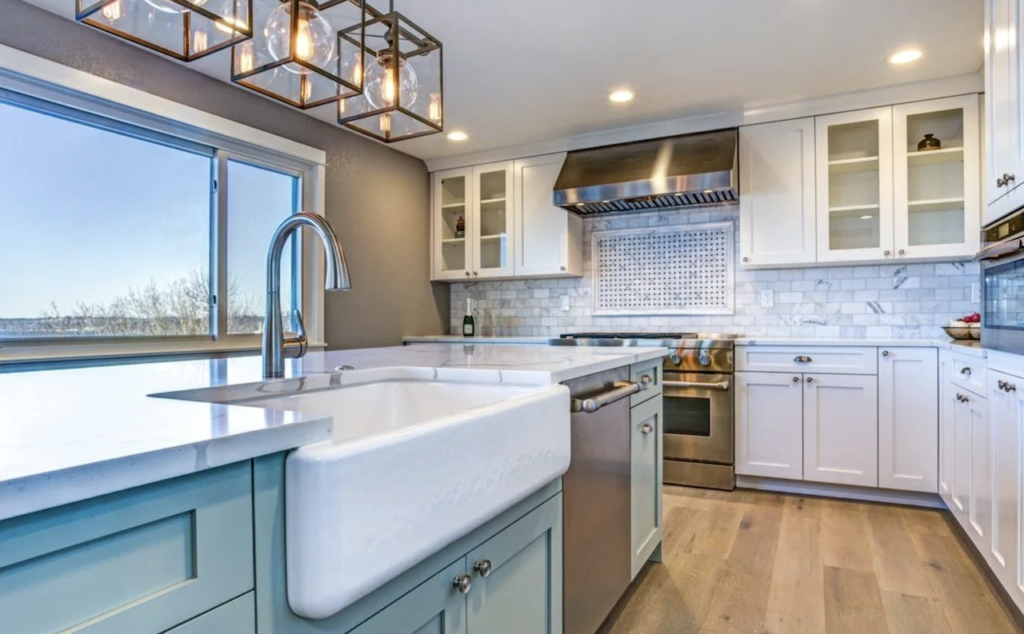Modern Farm style Kitchen Remodel with teal cabinets and white custom countertops in Northeast Ohio