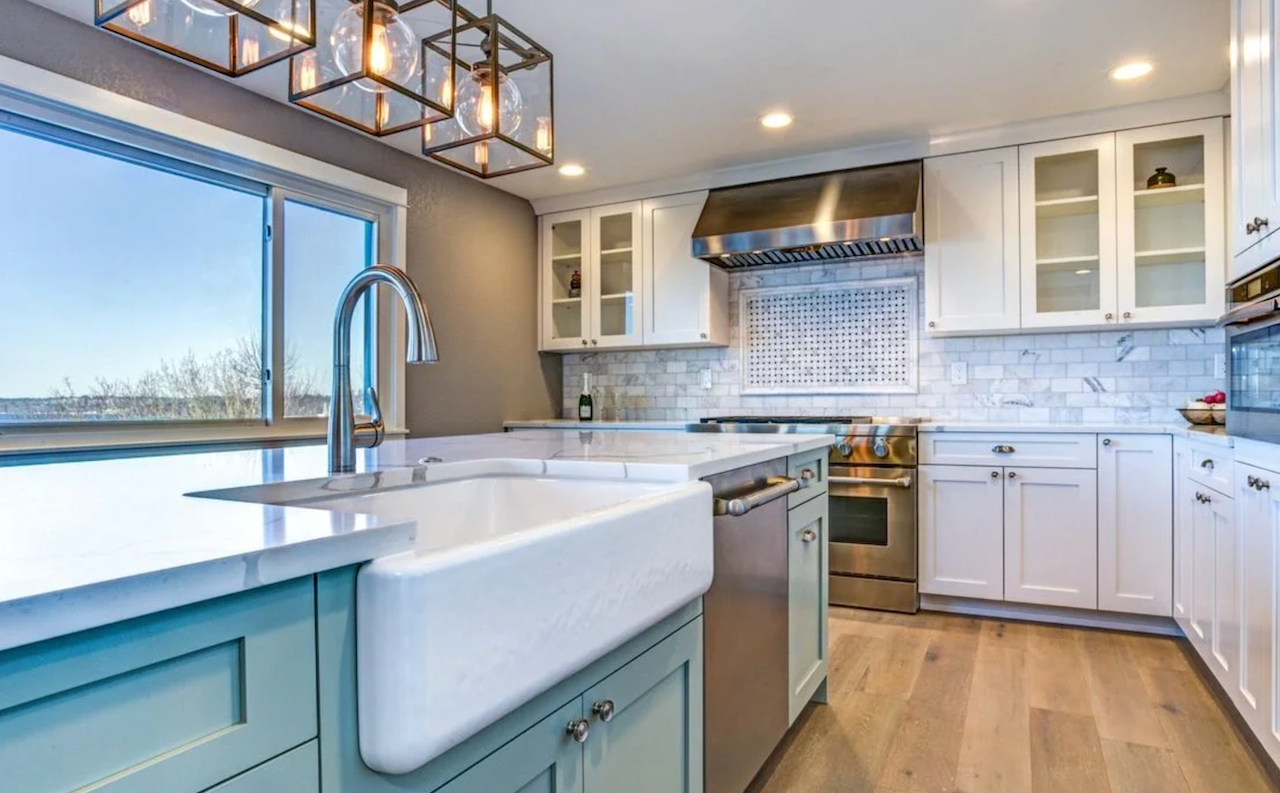 Modern Farm style Kitchen Remodel with teal cabinets and white custom countertops in Northeast Ohio