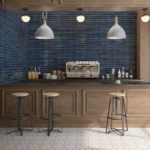 Stacked square Zellige tiles in a moody blue grey with natural light reflecting off the irregular glazed surface. | Mr.Countertops