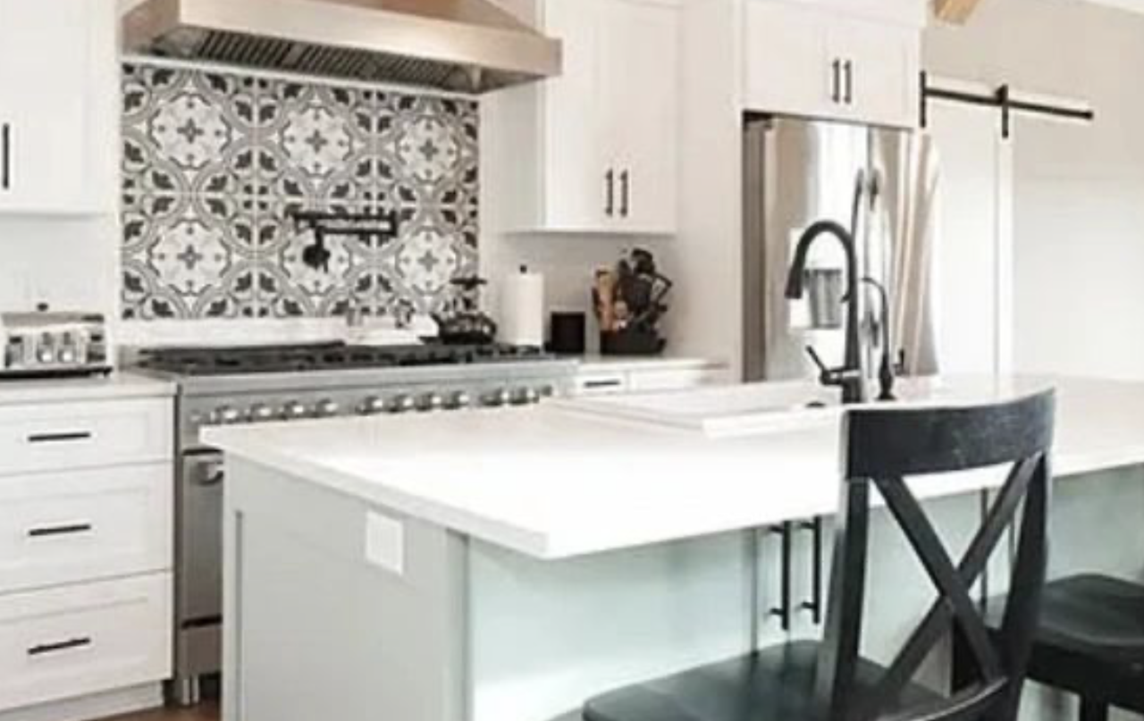 White Solid Surface Countertops and island in modern Kitchen Remodel.
