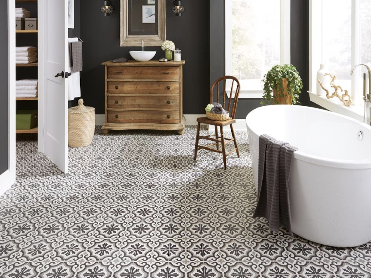 Modern Bathroom renovation with floating vanity sink, bathtub and black and white tile. Best Full Service In-House Bathroom Remodeling in Medina, OH | Mr.Countertops
