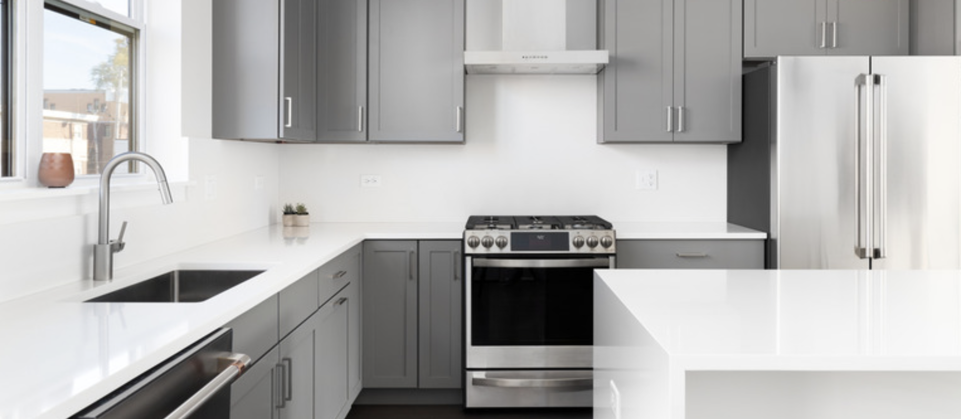 Sleek Kitchen Remodel with trending gray cabinets and white seamless countertops. | Mr.Countertops