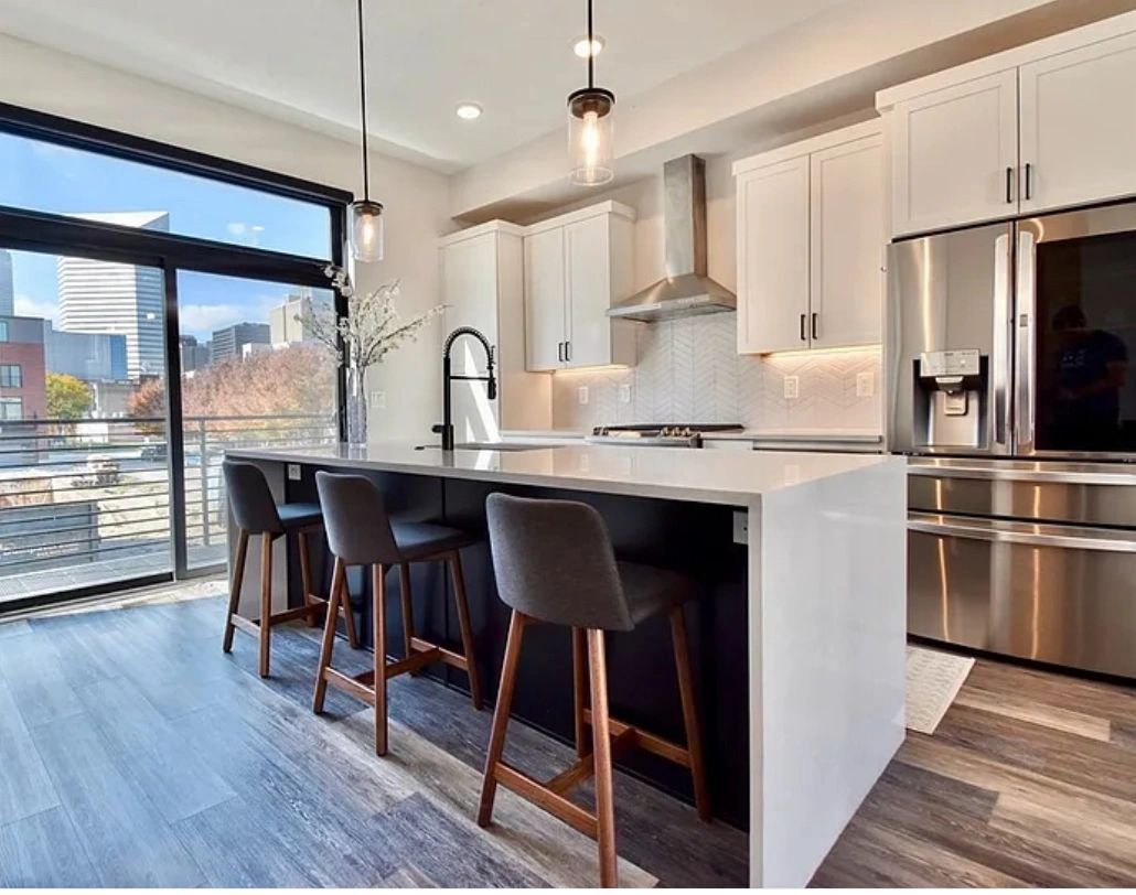 Custom Bar Style solid surface island in luxury apartment in Cleveland OH