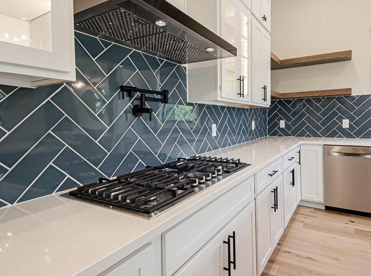 White Custom Countertops, with teal Herringbone tile installation in Modern NE OH kitchen | Mr.Countertops