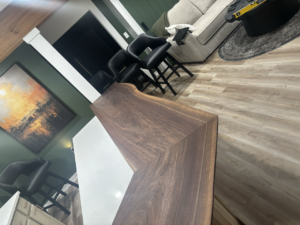 Handcrafted Live edge wood bar top with dark, food safe finish.